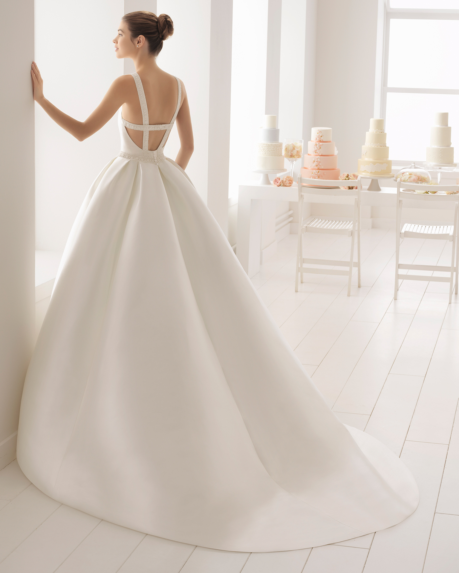 Classic-style beaded mikado wedding dress with halter neckline.