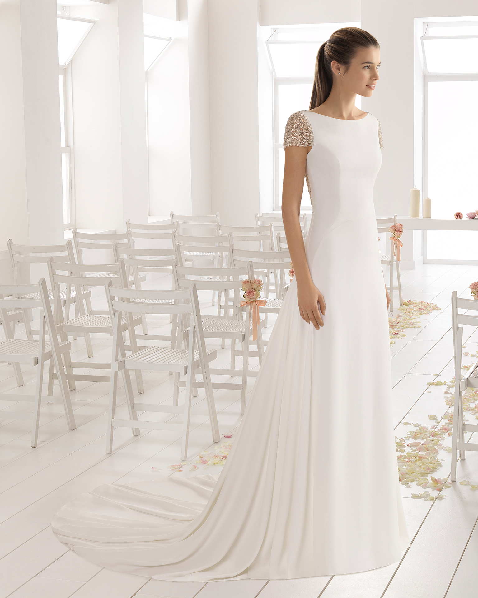 Classic-style crepe wedding dress with short sleeves and jewelled back with frosted beading.