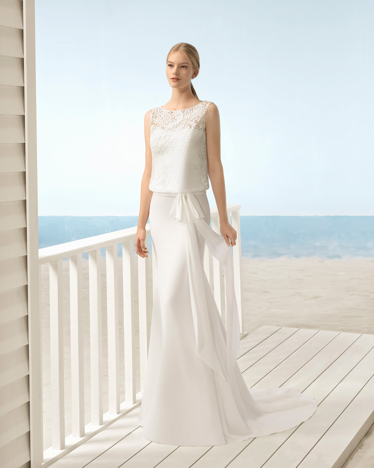 Boho-style lace and chiffon wedding dress with strapless bloused bodice with illusion overlay.